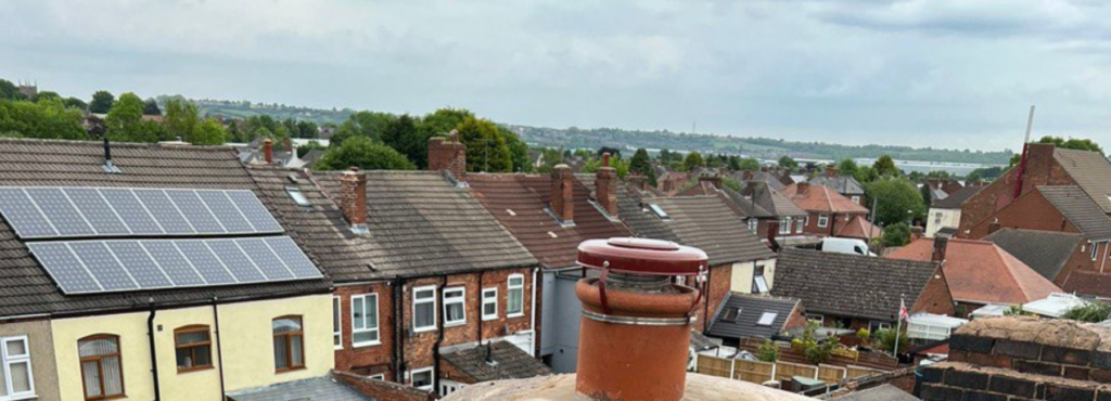 This is a photo taken from a roof which is being repaired by MCM Roofing Repairs Shaftesbury, it shows a street of houses, and their roofs